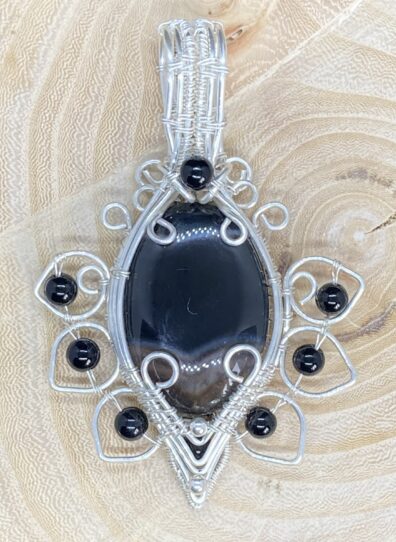 Onyx cabochon and accents
