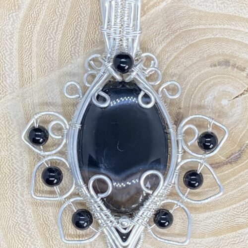Onyx cabochon and accents